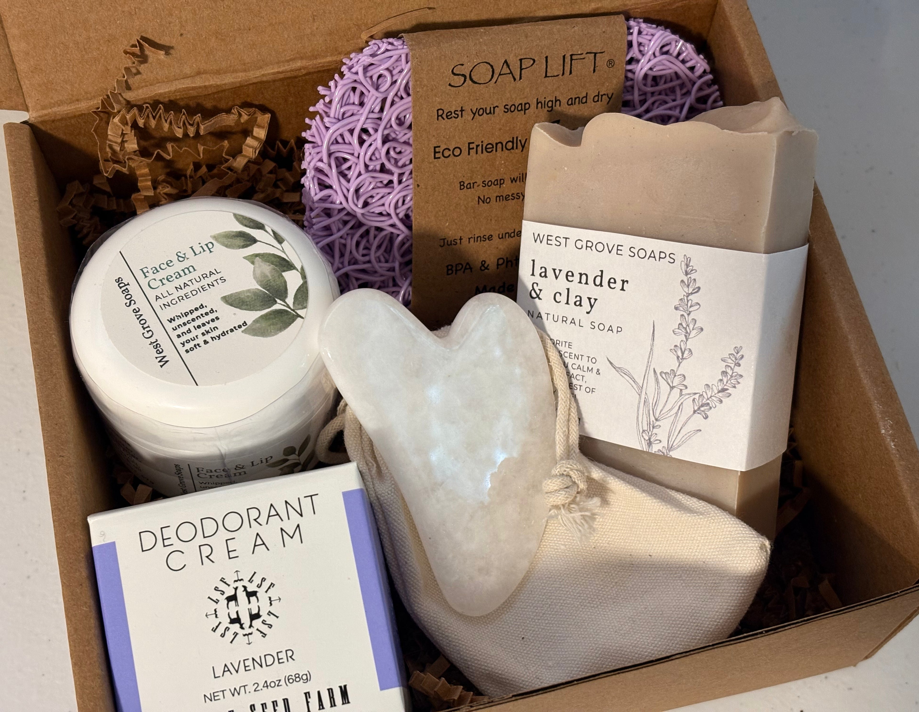 Gift box containing various all-natural body products sold at West Grove Soaps featuring Lavender scent