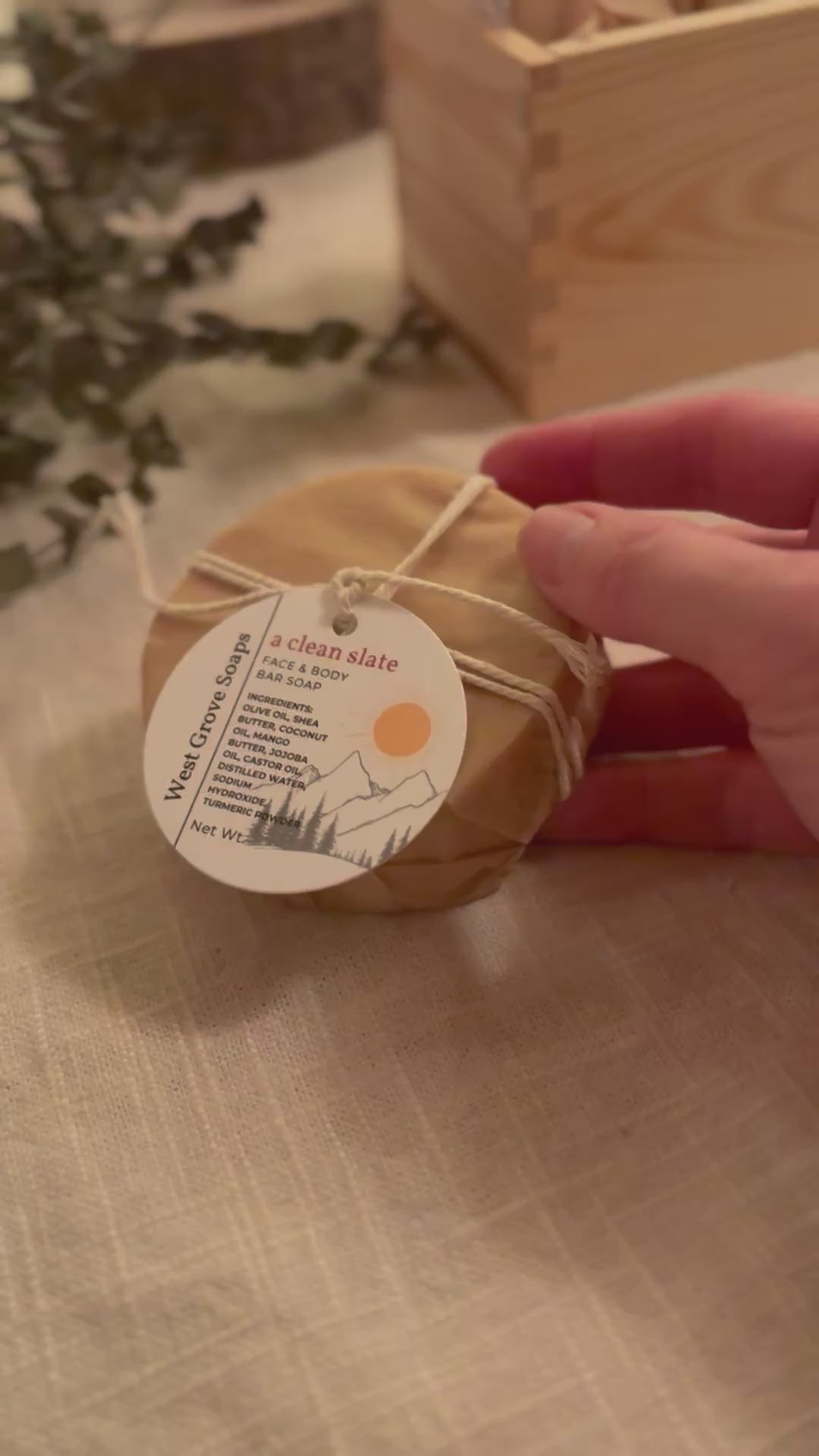 Hand is displaying the size of our face soap bar by holding the bar up and moving the soap bar